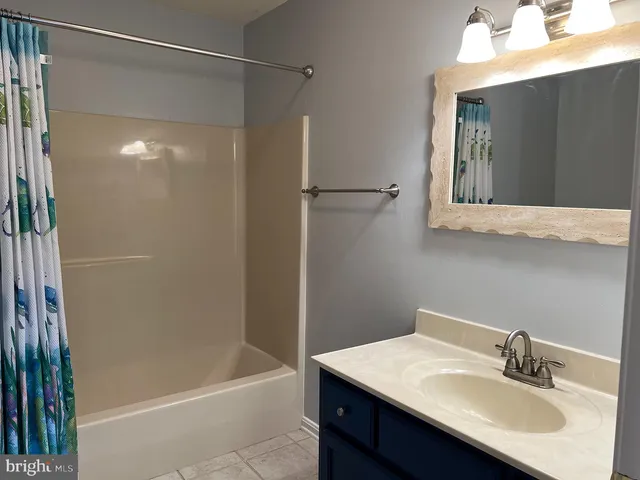 a bathroom with a sink and a bathtub