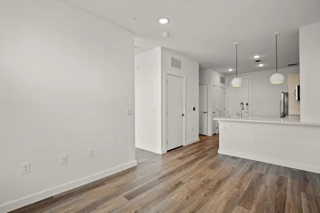 a view of a kitchen with wooden floor