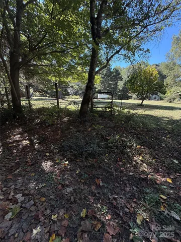 a view of a backyard of the house