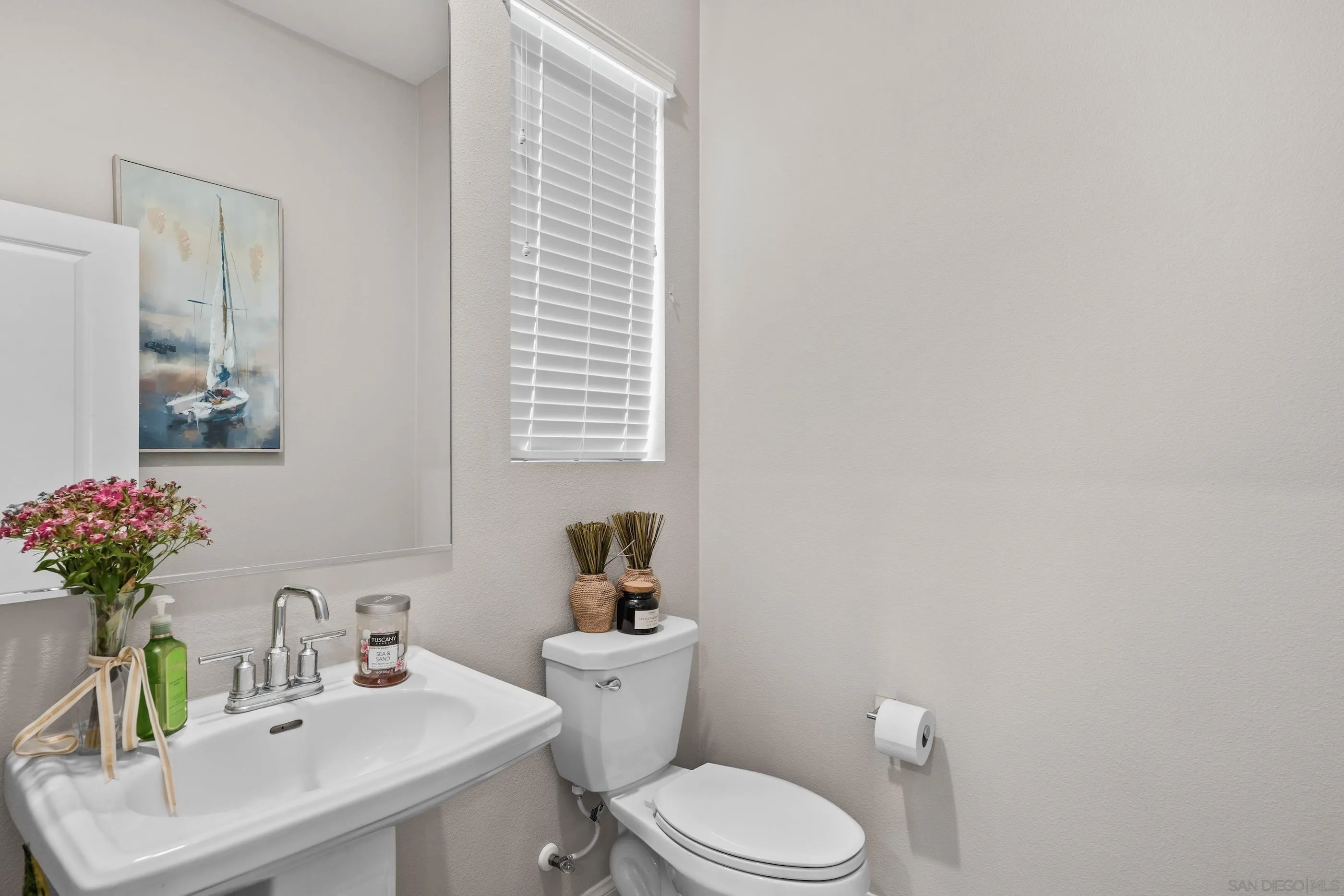 2098 Bluestone Circle Chula Vista, CA 91913 - Photo 13 of 25 a bathroom with a sink toilet and a mirror