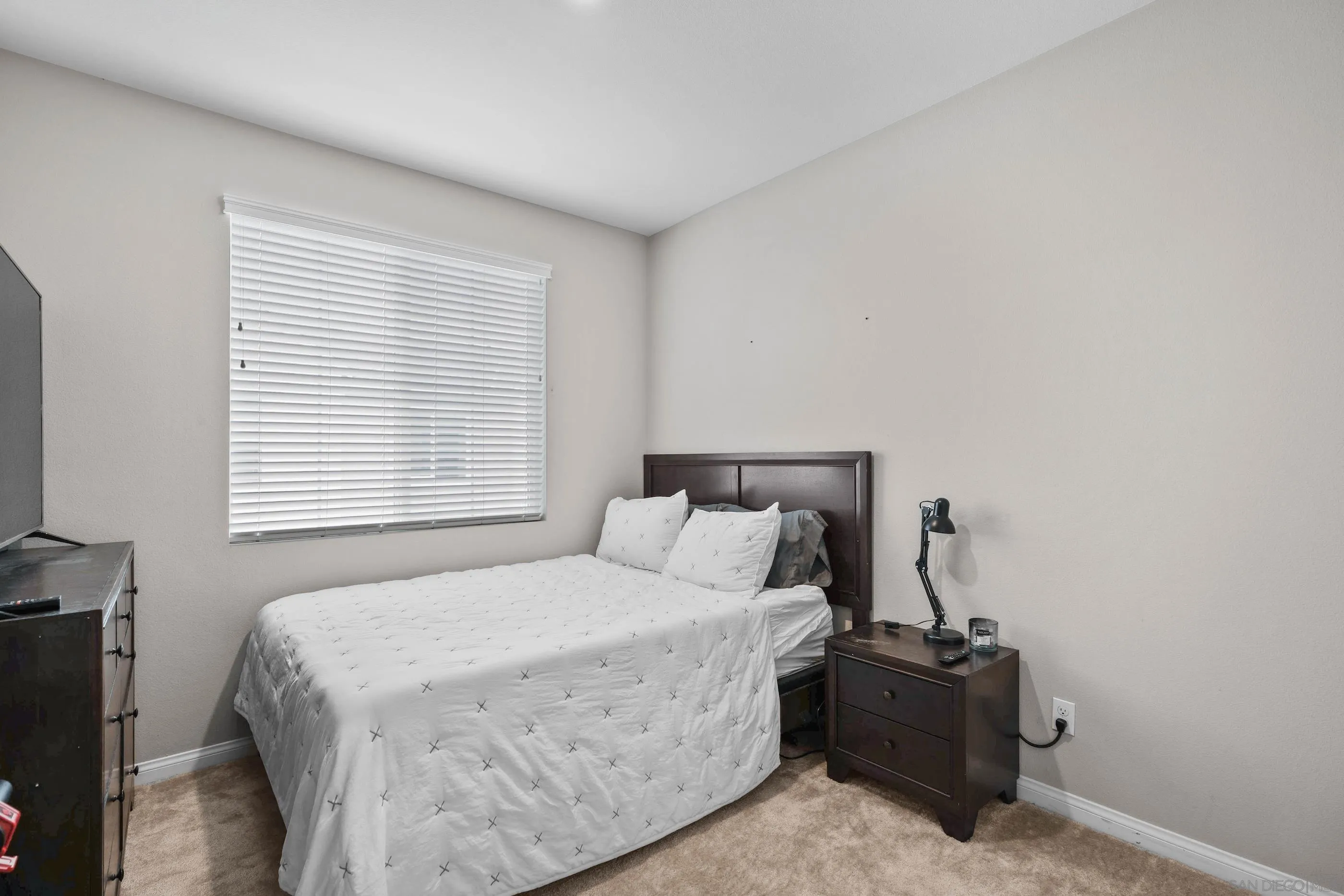 2098 Bluestone Circle Chula Vista, CA 91913 - Photo 14 of 25 a bedroom with a bed and window