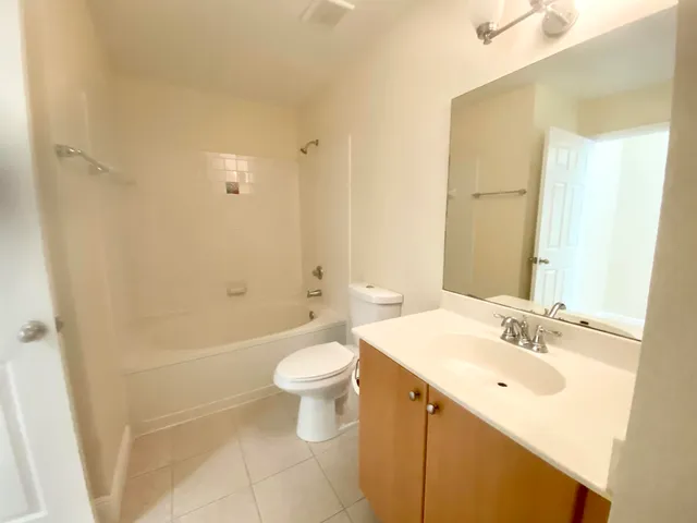 a bathroom with a sink a toilet and bathtub