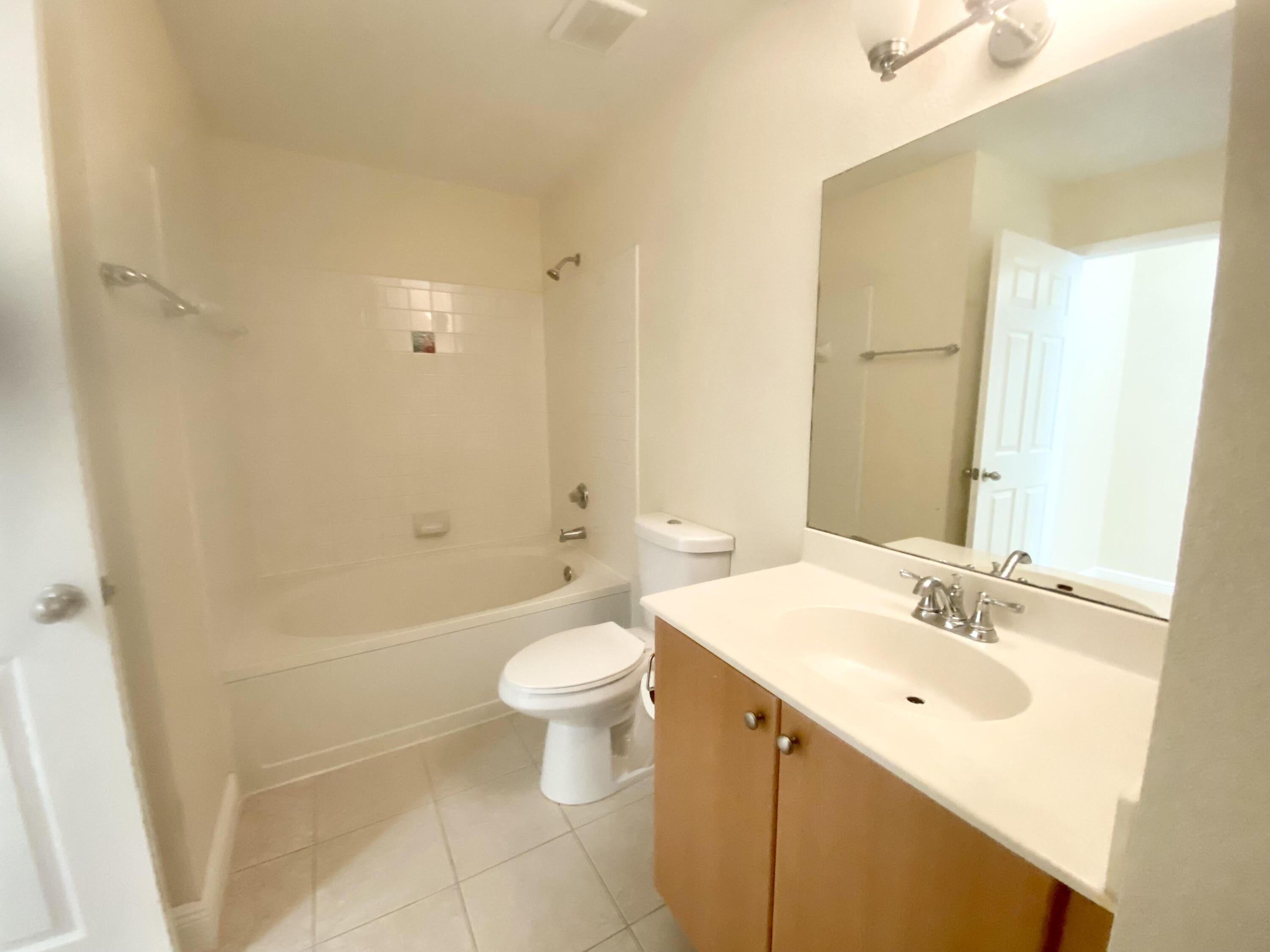 1745 Palm Cove Boulevard, Unit 3101 Delray Beach, FL 33445 - Photo 16 of 33 a bathroom with a sink a toilet and bathtub