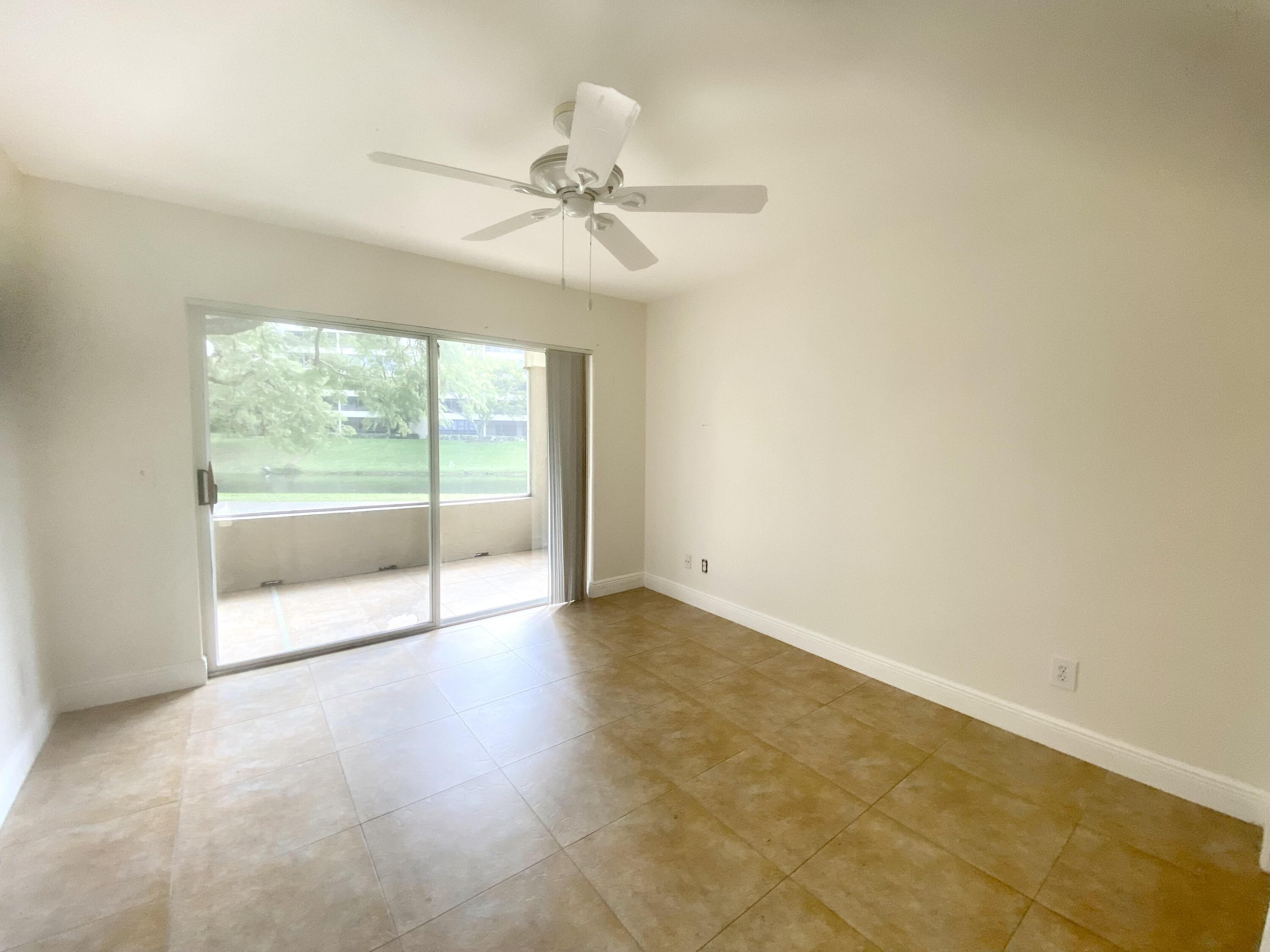 1745 Palm Cove Boulevard, Unit 3101 Delray Beach, FL 33445 - Photo 17 of 33 a view of an empty room with a window