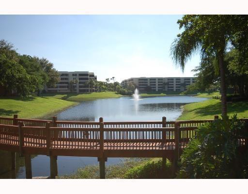 1745 Palm Cove Boulevard, Unit 3101 Delray Beach, FL 33445 - Photo 3 of 33 a view of a deck with a lake view