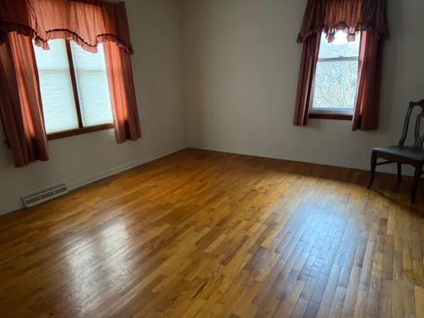 a view of an empty room with a window