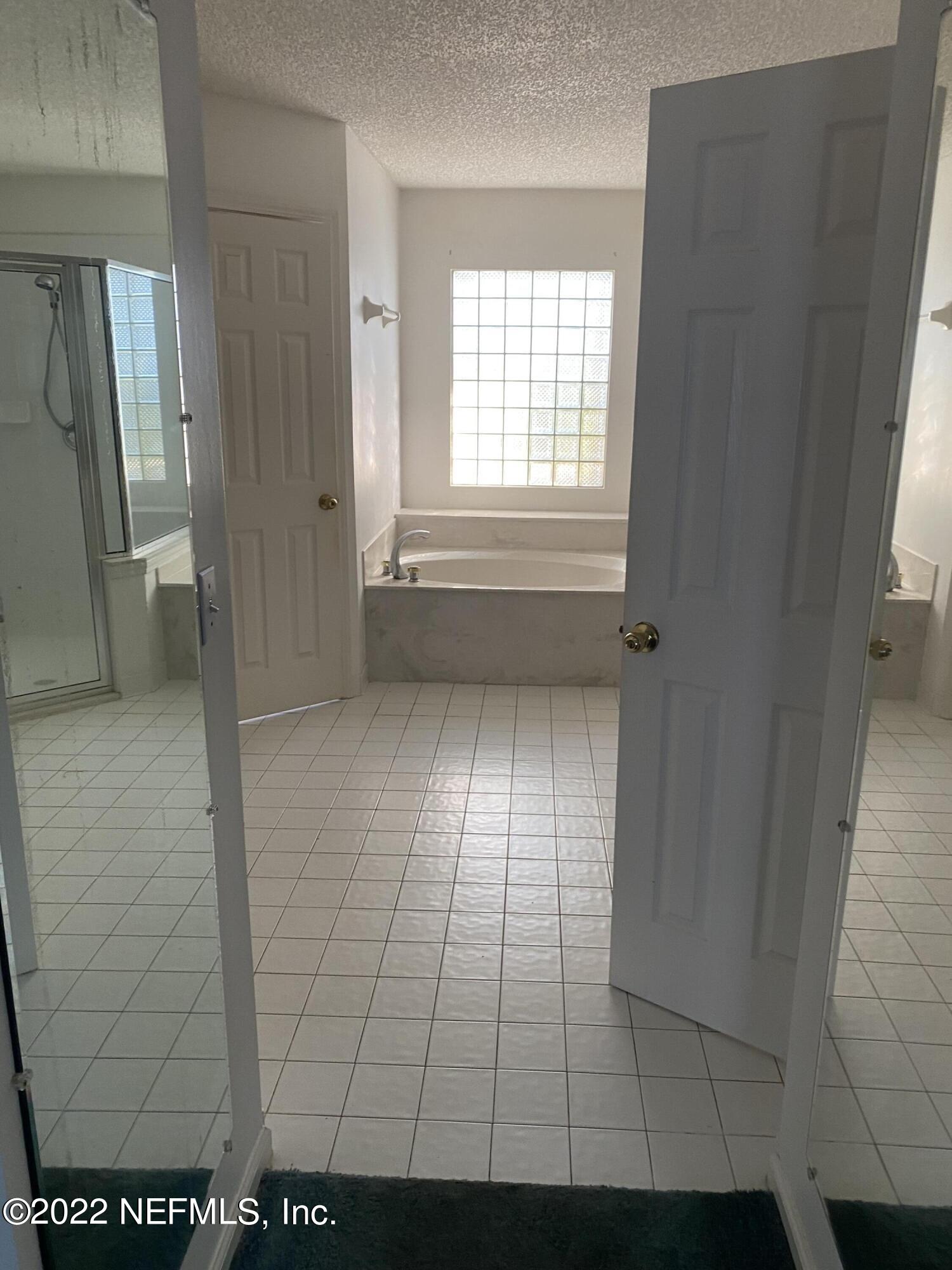 627 Cherry Street Neptune Beach, FL 32266 - Photo 11 of 17 a view of an empty room and window