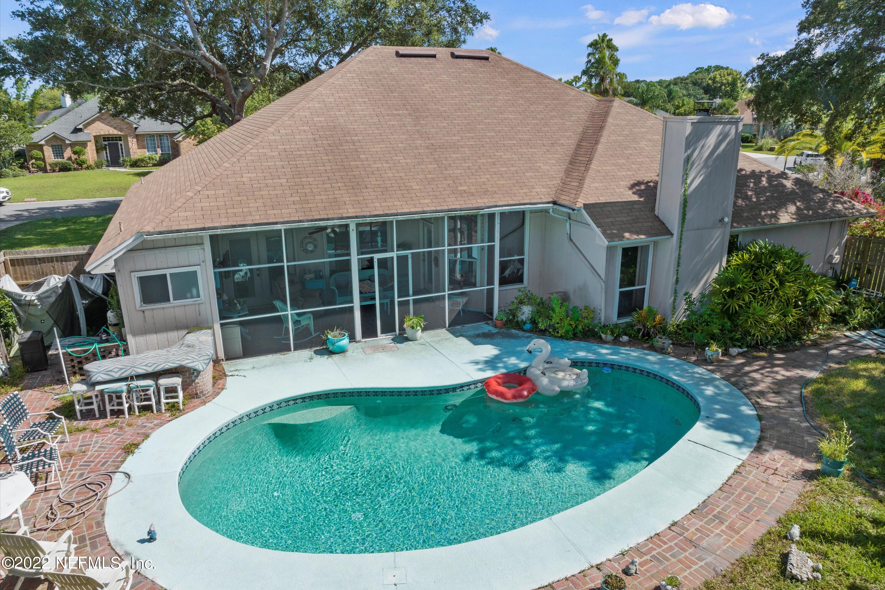 627 Cherry Street Neptune Beach, FL 32266 - Photo 14 of 17 a view of a house with swimming pool and porch
