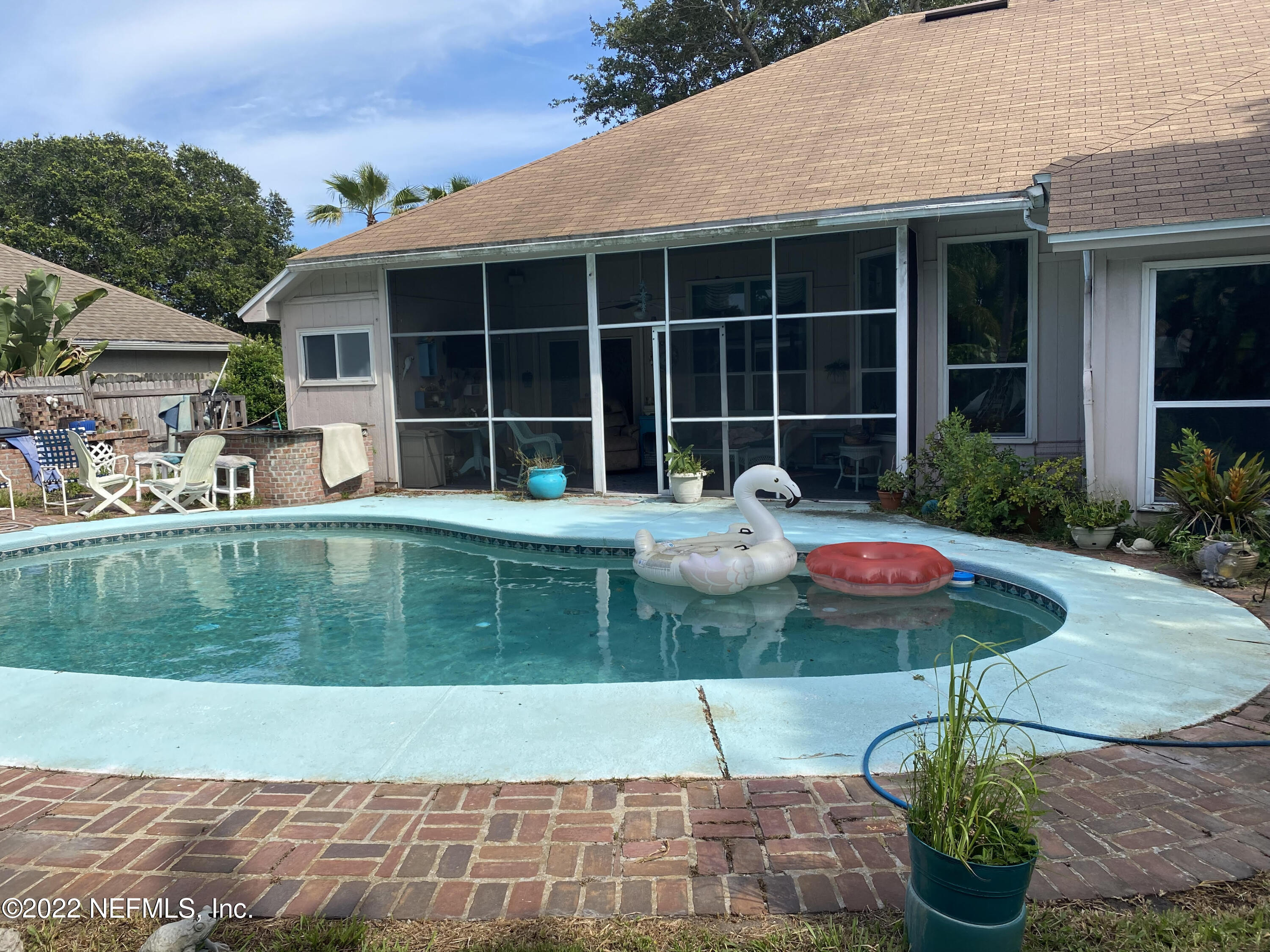 627 Cherry Street Neptune Beach, FL 32266 - Photo 15 of 17 a front view of a house with a yard and garage