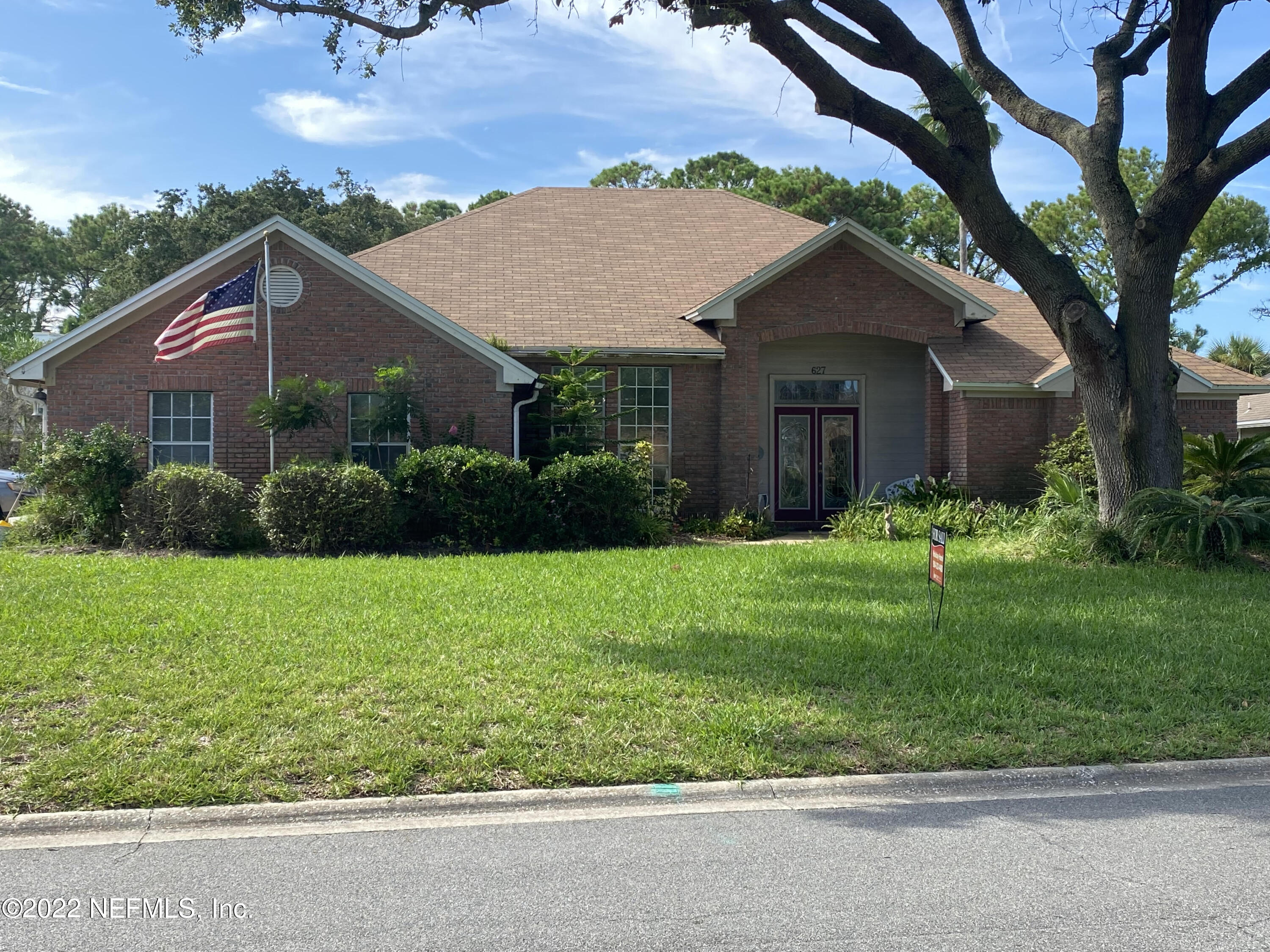 627 Cherry Street Neptune Beach, FL 32266 - Photo 2 of 17 a house view with a garden space
