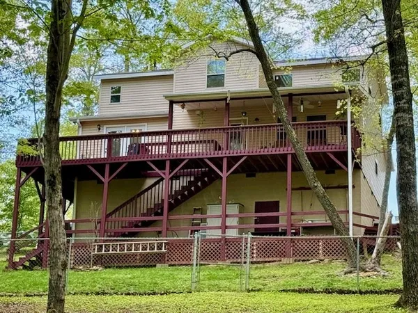 a living room with stainless steel appliances kitchen island granite countertop furniture and a kitchen view