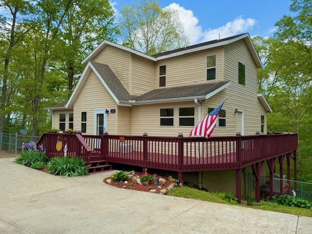 329 Tommy's Lane Murphy, NC 28906 - Photo 2 of 77 a front view of a house with a garden and deck