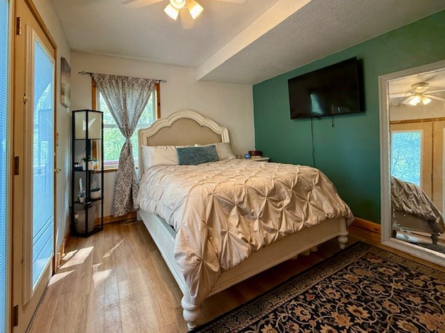 329 Tommy's Lane Murphy, NC 28906 - Photo 32 of 77 a spacious bedroom with a bed and a flat screen tv