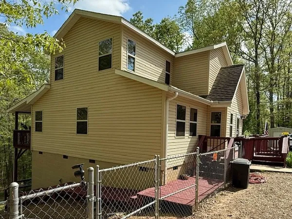 a front view of a house having garden