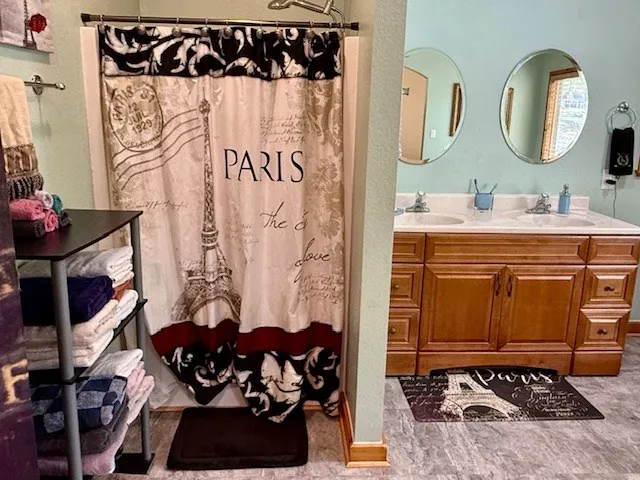 a bathroom with a toilet a sink and a shower