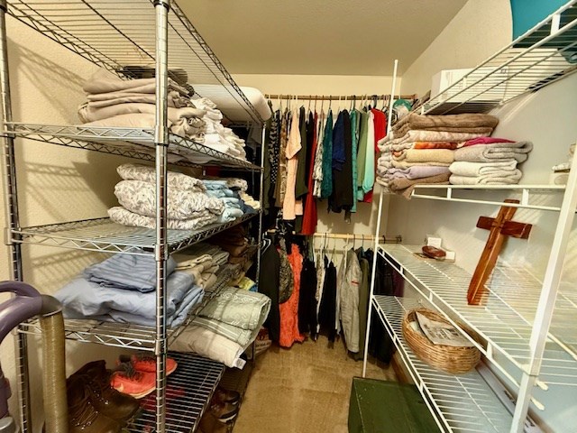 329 Tommy's Lane Murphy, NC 28906 - Photo 47 of 77 a view of walk in closet with clothes and shoes