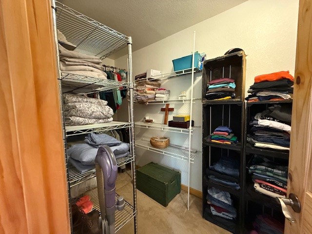 329 Tommy's Lane Murphy, NC 28906 - Photo 48 of 77 a view of walk in closet with clothes and shoes