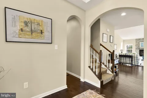 a bedroom with a bed and large windows