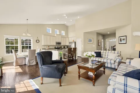 a living room with furniture and a table