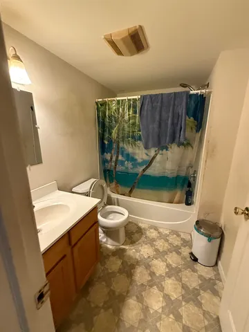a bathroom with a sink and toilet
