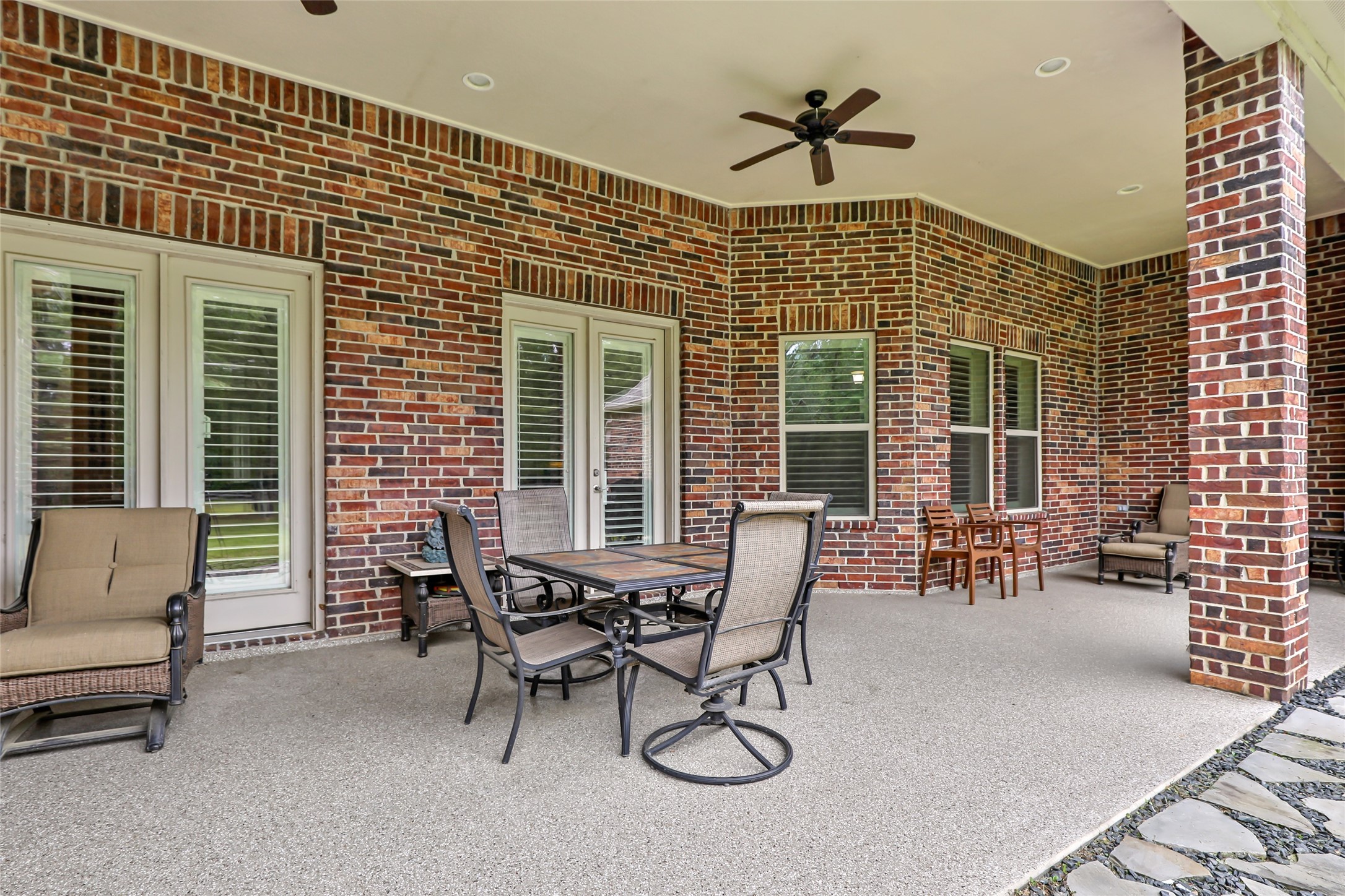 229 Sundog Road Huntsville, TX 77340 - Photo 46 of 50 Covered back porch where you can sit, relax, and enjoy a Texas style BBQ!