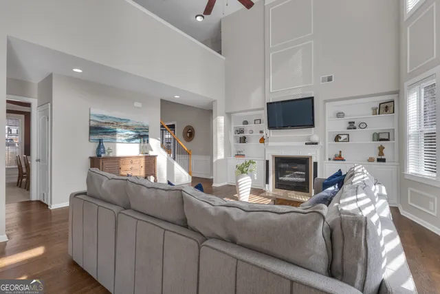 a kitchen with stainless steel appliances granite countertop a stove a sink a refrigerator and a microwave