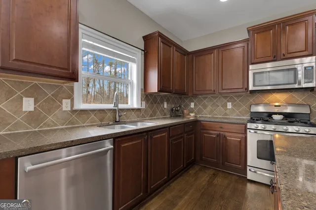 a spacious bedroom with a bed and a chandelier