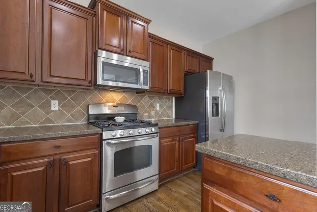 a bedroom with a bed and ceiling fan