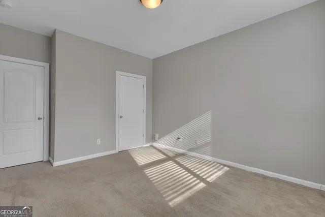 a bathroom with a bathtub and a window