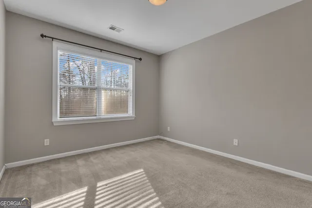 a white bath tub sitting next to a window