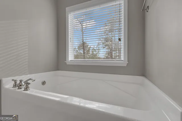 a view of an empty room and a window