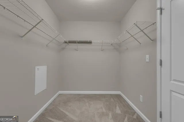 a bathroom with a toilet sink vanity and mirror