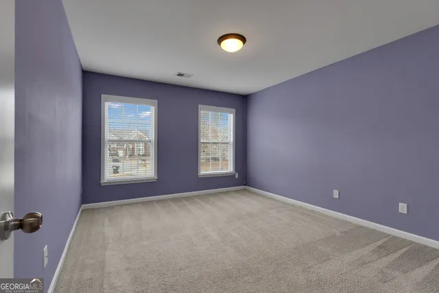 a view of a house with a door and wooden roof