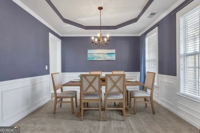 a living room with fireplace furniture and a flat screen tv