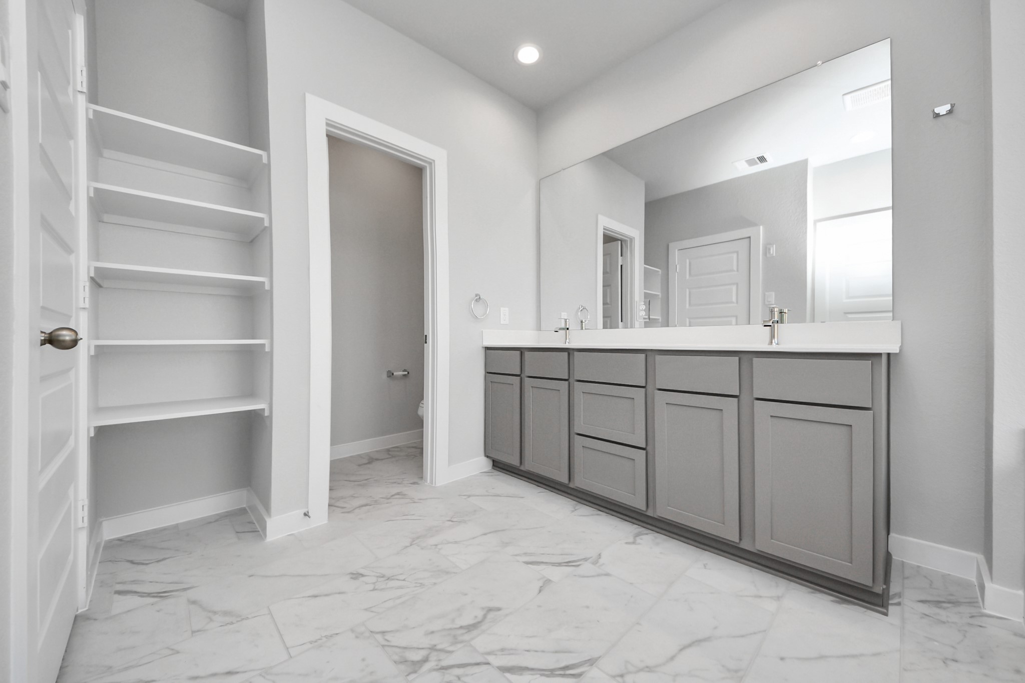 3002 Bury Park Dr Spring Spring, TX 77373 - Photo 27 of 45 Elevate your daily routine at the elegant vanity, now equipped with double sinks, light countertops, modern hardware, and beautiful recessed lights.