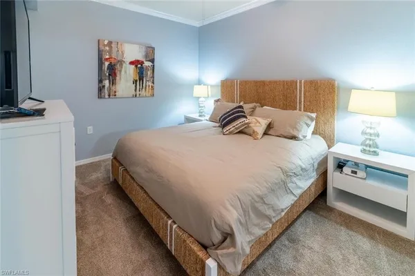 a bed room with a bed and a night stand