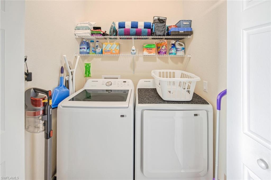9731 Acqua Court, Unit 541 Naples, FL 34113 - Photo 19 of 48 a utility room with dryer and washer