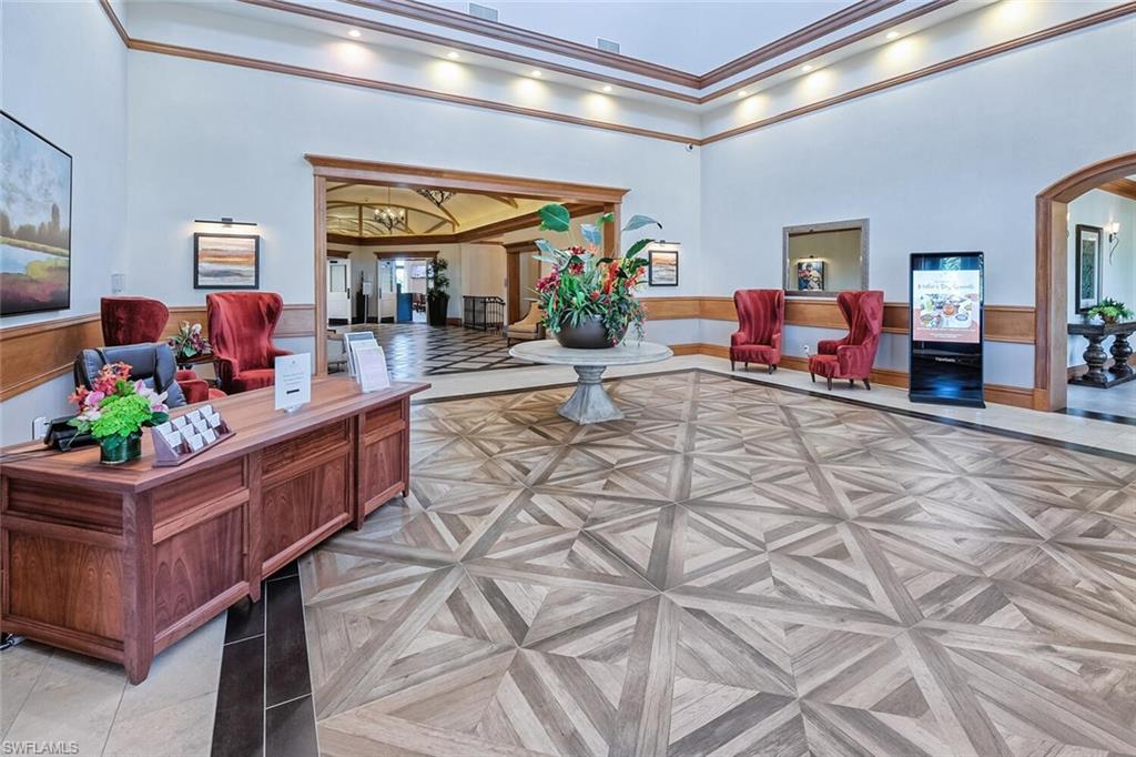 9731 Acqua Court, Unit 541 Naples, FL 34113 - Photo 28 of 48 a living room with furniture and a potted plant