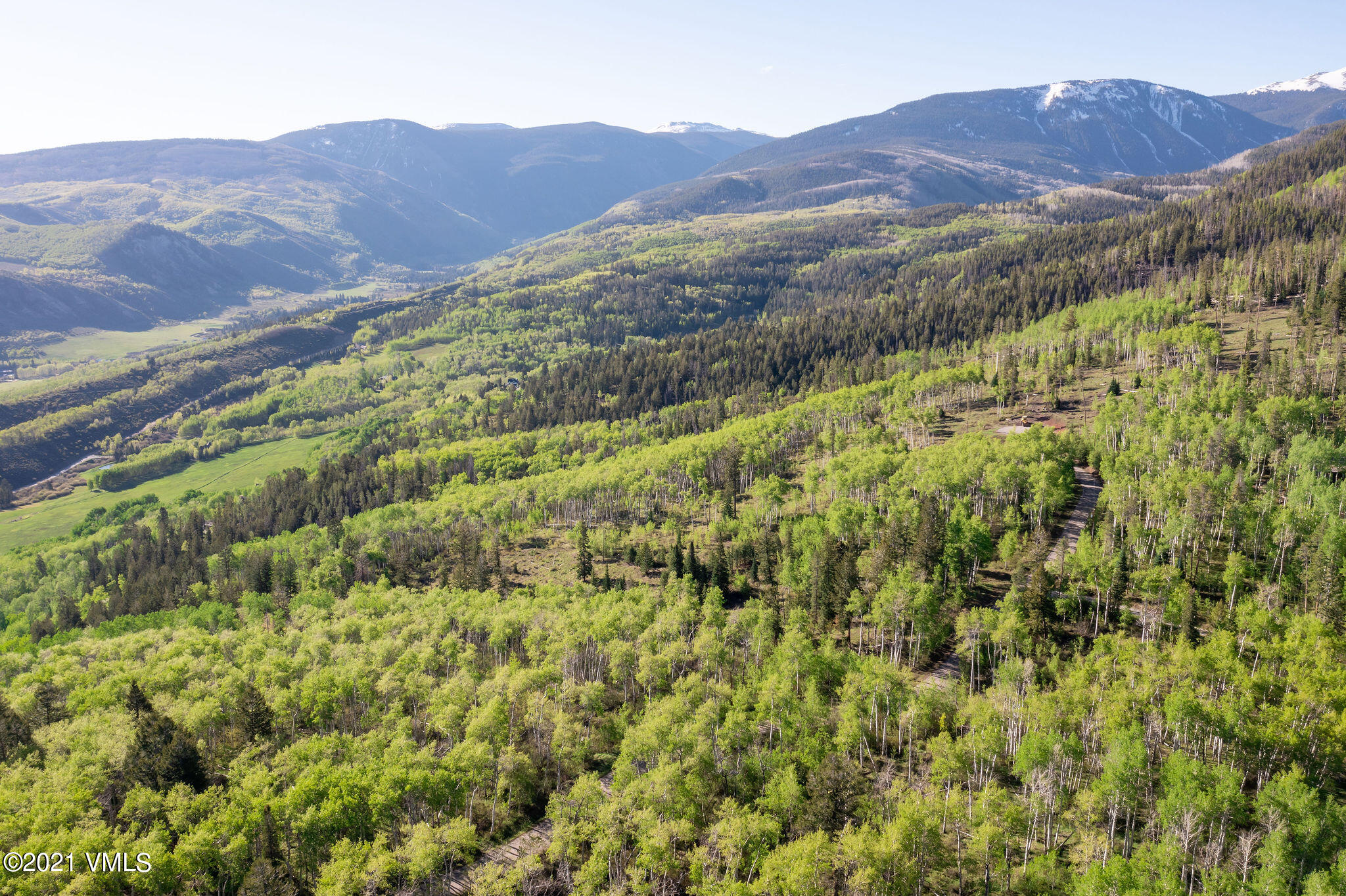 2525 Colorow Road Edwards, CO 81632 - Photo 4 of 20 a view of a lush green hillside and a houses