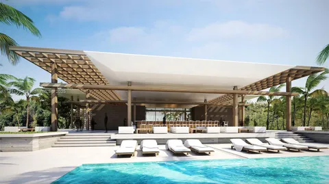 a view of a swimming pool with an outdoor kitchen