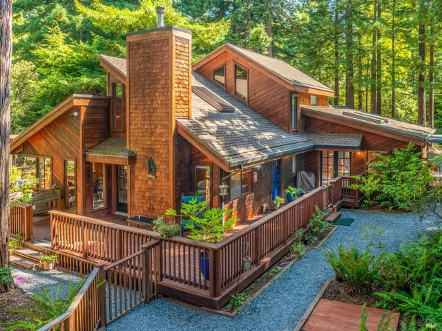 a view of a house with wooden fence