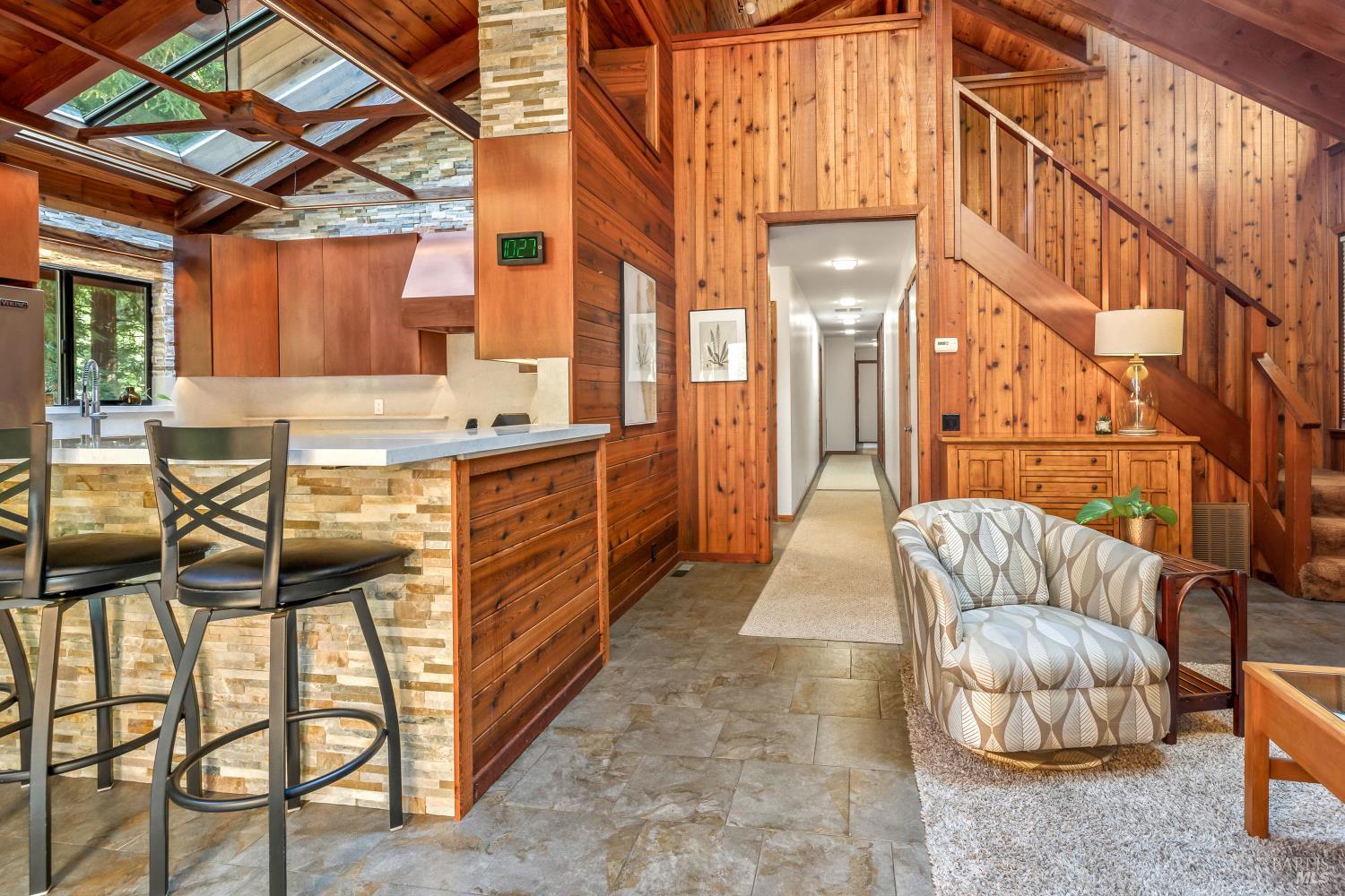 17451 Redwood Springs Drive Fort Bragg, CA 95437 - Photo 12 of 43 a living room with furniture and a chandelier