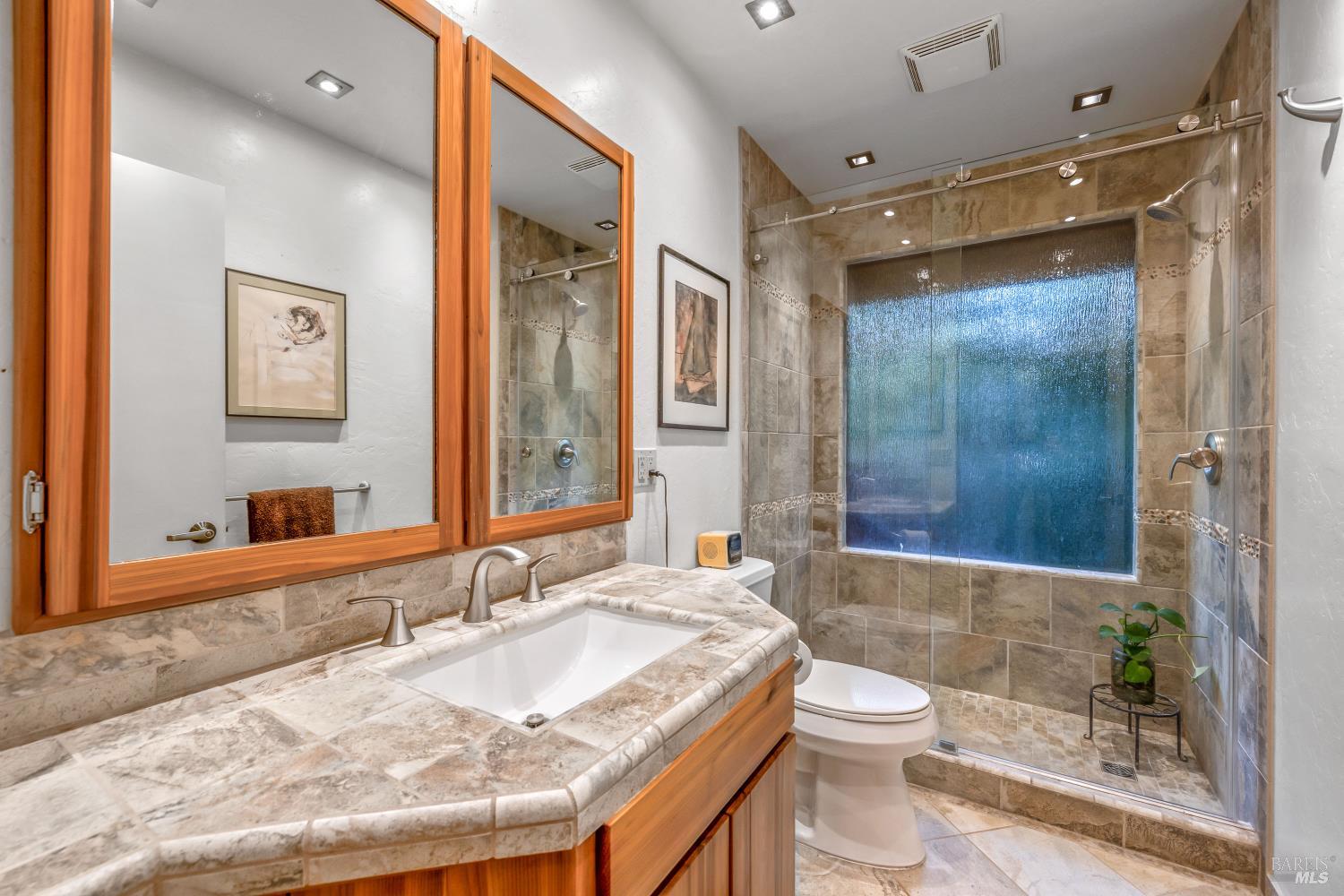 17451 Redwood Springs Drive Fort Bragg, CA 95437 - Photo 13 of 43 a bathroom with a granite countertop sink toilet and shower