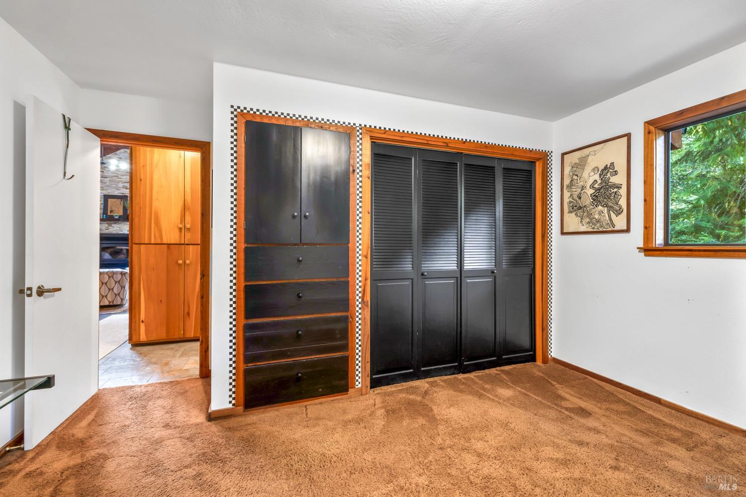 17451 Redwood Springs Drive Fort Bragg, CA 95437 - Photo 15 of 43 a view of an empty room with a fireplace and a window