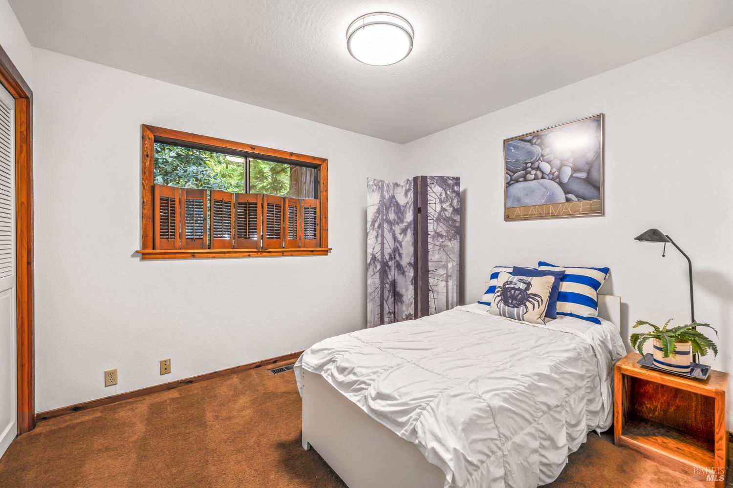 17451 Redwood Springs Drive Fort Bragg, CA 95437 - Photo 22 of 43 a bedroom with bed and window