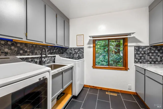 a view of a backyard with a table and chairs