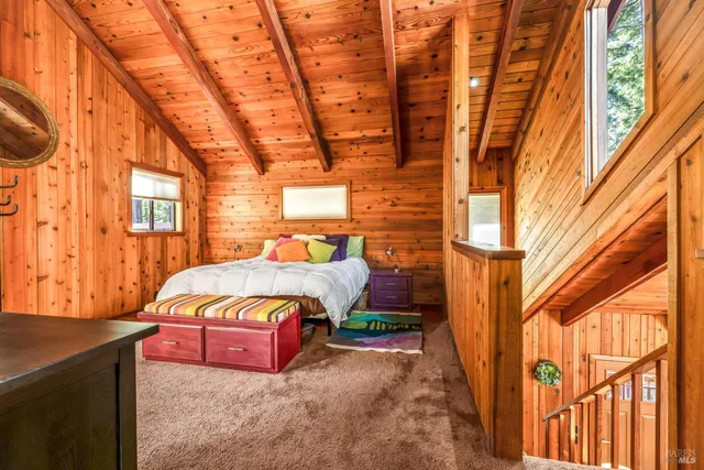 a backyard of a house with outdoor seating