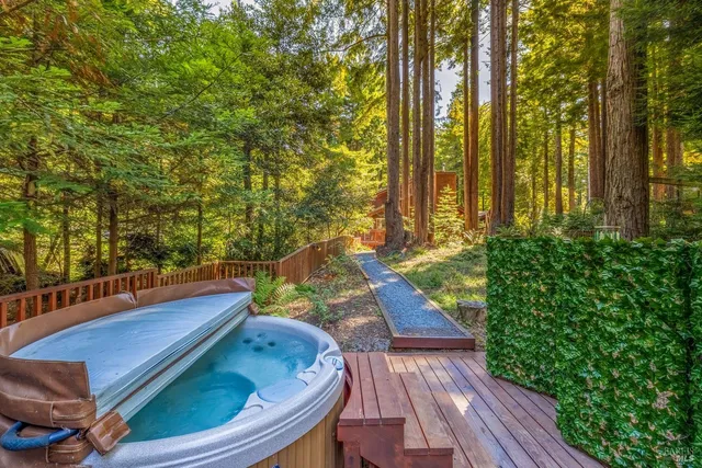 a dining room with furniture a fireplace and wooden floor