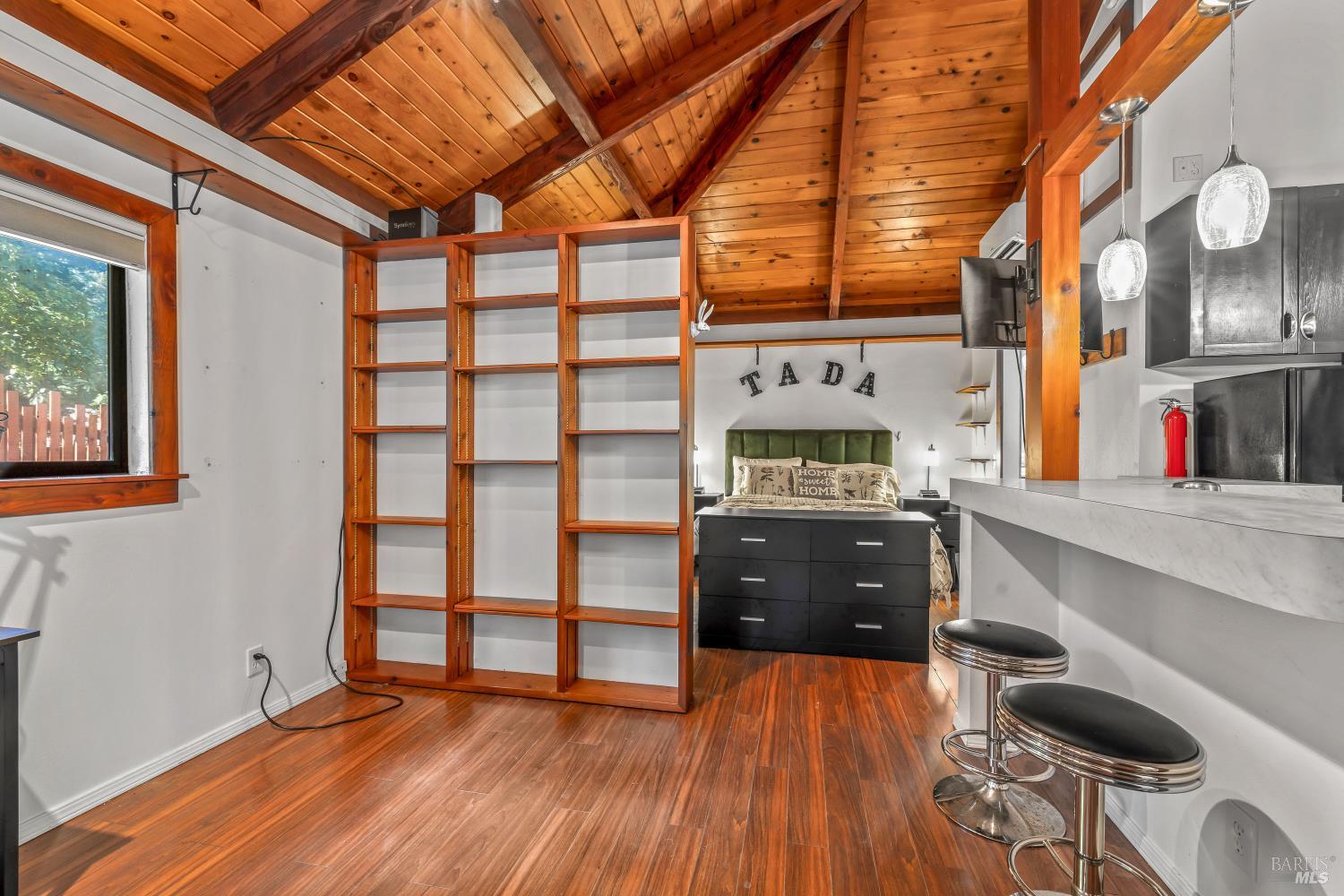 17451 Redwood Springs Drive Fort Bragg, CA 95437 - Photo 34 of 43 a kitchen with a wooden floor and a stove
