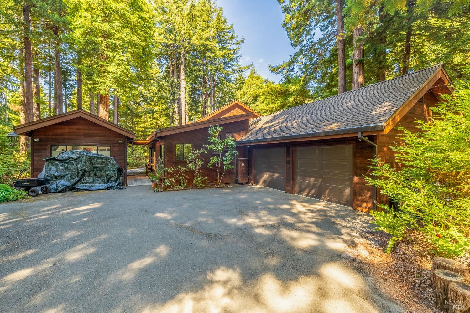 17451 Redwood Springs Drive Fort Bragg, CA 95437 - Photo 39 of 43 a front view of a house with a yard